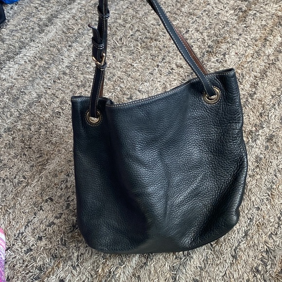 Dooney and Bourke pebbled leather shoulder bag black does have flaws